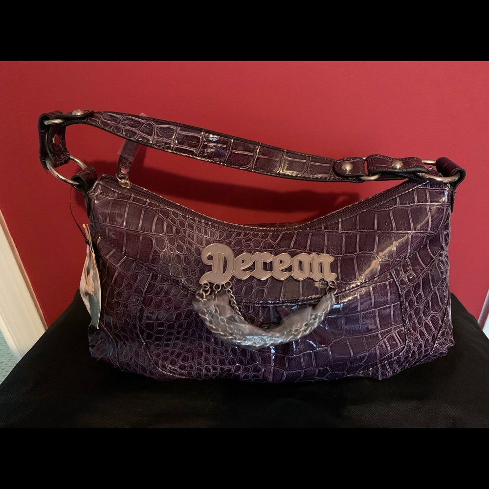 Gorgeous purple vintage designer bag by Beyonce